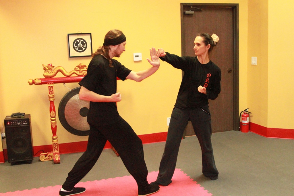 Natalia doing a partner work with Dmitry Prosvirov. They do a Kung Fu class in March 2016.